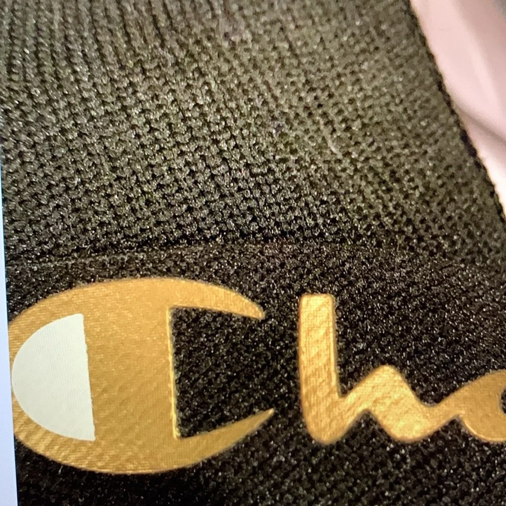 Champion Black and Gold Slip-On Sneakers Sleek Design, size 7